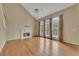 Living room featuring a fireplace, hardwood floors, and tall ceilings at 4815 Rapids Nw Cir, Acworth, GA 30102