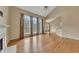 Spacious living room with hardwood floors, fireplace, and large windows at 4815 Rapids Nw Cir, Acworth, GA 30102