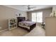 Cozy bedroom with neutral walls, ceiling fan, carpeted floors and a lovely decor at 1921 Northbrooke Ln, Dunwoody, GA 30338