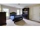 Neutral bedroom featuring carpet floors, windows, a dark wood bed frame and matching furniture at 1921 Northbrooke Ln, Dunwoody, GA 30338