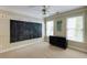Versatile bonus room with a chalkboard wall, natural light, and ample space for activities at 1921 Northbrooke Ln, Dunwoody, GA 30338