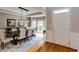 Elegant dining room with a modern chandelier, large windows, and hardwood floors at 1921 Northbrooke Ln, Dunwoody, GA 30338