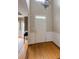 Bright entryway featuring hardwood floors and white wainscoting, leading to living areas at 1921 Northbrooke Ln, Dunwoody, GA 30338