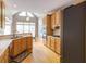 Bright kitchen boasts wood cabinets, stainless appliances, and an eat-in area with lots of natural light at 1921 Northbrooke Ln, Dunwoody, GA 30338