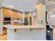 Well-equipped kitchen with modern stainless steel appliances and breakfast bar at 1921 Northbrooke Ln, Dunwoody, GA 30338