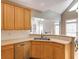 Open kitchen concept featuring a breakfast bar and stainless steel sink at 1921 Northbrooke Ln, Dunwoody, GA 30338