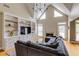 Spacious living room featuring built-in shelves, fireplace, and cozy gray sectional sofa at 1921 Northbrooke Ln, Dunwoody, GA 30338