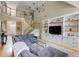 Open-concept living room with a staircase and a large comfortable couch at 1921 Northbrooke Ln, Dunwoody, GA 30338