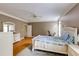 Comfortable main bedroom with white furniture, hardwood floors, and natural light at 1921 Northbrooke Ln, Dunwoody, GA 30338