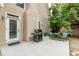 Back patio with a grill, table and chairs, and views of the yard and back of the house at 1921 Northbrooke Ln, Dunwoody, GA 30338