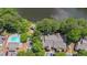 Birds eye view of condo community, pool, parking and neighboring lake at 2214 Lake Pointe Cir, Roswell, GA 30075