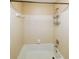 Clean and functional bathroom with tile surround bathtub at 2214 Lake Pointe Cir, Roswell, GA 30075