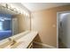 Bathroom vanity with large mirror and good lighting at 2214 Lake Pointe Cir, Roswell, GA 30075