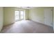 Bedroom with carpet, ceiling fan, and large windows at 2214 Lake Pointe Cir, Roswell, GA 30075
