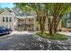 Inviting condo complex with tan siding, green trees, and a well-maintained lawn at 2214 Lake Pointe Cir, Roswell, GA 30075