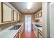 Traditional kitchen features white cabinets, stainless steel sink, and a window view at 2214 Lake Pointe Cir, Roswell, GA 30075