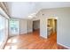 Spacious living room with wood floors, vaulted ceiling, a ceiling fan, and plenty of natural light at 2214 Lake Pointe Cir, Roswell, GA 30075