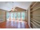 Bright living room with wood floors, built-in shelving, vaulted ceilings and lots of natural light at 2214 Lake Pointe Cir, Roswell, GA 30075