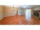 Spacious living room featuring a stone fireplace, wood floors, and great natural lighting at 2214 Lake Pointe Cir, Roswell, GA 30075