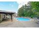 Community pool with ample seating and shaded area for relaxing poolside at 2214 Lake Pointe Cir, Roswell, GA 30075