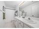 Bathroom featuring double vanity sinks, neutral paint, and black hardware with a shower and tub at 2711 Brookefield Nw Ln, Kennesaw, GA 30152