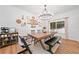 Spacious dining room with modern chandelier and access to an outdoor view at 2711 Brookefield Nw Ln, Kennesaw, GA 30152