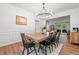 Bright dining room with a large wooden table and decorative chandelier at 2711 Brookefield Nw Ln, Kennesaw, GA 30152