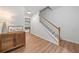 Bright foyer with hardwood floors, stairs, and a view into the dining area at 2711 Brookefield Nw Ln, Kennesaw, GA 30152