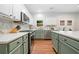 Bright kitchen features stainless appliances, solid surface countertops, and stylish cabinets at 2711 Brookefield Nw Ln, Kennesaw, GA 30152