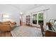 Inviting living room with a neutral palette, hardwood floors, and a large window at 2711 Brookefield Nw Ln, Kennesaw, GA 30152