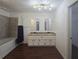 Bright bathroom features a double vanity and a shower/tub at 2821 Ne Meadowlark Trail, Duluth, GA 30096