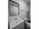 A clean bathroom features a sink with a chrome faucet, and a large mirror above the vanity at 2821 Ne Meadowlark Trail, Duluth, GA 30096