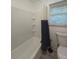 Bathroom featuring bath tub with shower and window at 2821 Ne Meadowlark Trail, Duluth, GA 30096