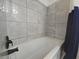 Bathroom features updated tiles, modern fixtures, and a tub at 2821 Ne Meadowlark Trail, Duluth, GA 30096