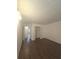 Bedroom featuring hardwood floors and closet with louvered doors at 2821 Ne Meadowlark Trail, Duluth, GA 30096