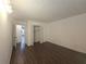 Bedroom featuring hardwood floors and closet with louvered doors at 2821 Ne Meadowlark Trail, Duluth, GA 30096