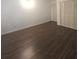 Bedroom featuring hardwood floors and closet with louvered doors at 2821 Ne Meadowlark Trail, Duluth, GA 30096