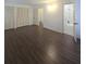 Bedroom featuring ensuite bath and closet with louvered doors at 2821 Ne Meadowlark Trail, Duluth, GA 30096