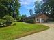 Charming single-story home boasts manicured lawns, beautiful landscaping, and a welcoming driveway for Gathering and guests at 2821 Ne Meadowlark Trail, Duluth, GA 30096