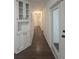 Bright hallway leads to the bathroom, and highlights built-in cabinets for added storage at 2821 Ne Meadowlark Trail, Duluth, GA 30096