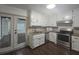 Well-equipped kitchen with modern appliances and white cabinets at 2821 Ne Meadowlark Trail, Duluth, GA 30096