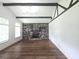 Bright living room with a brick fireplace and a decorative ceiling at 2821 Ne Meadowlark Trail, Duluth, GA 30096