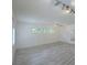 Spacious living room with light wood-look floors and neutral walls creates a bright and airy atmosphere at 2821 Ne Meadowlark Trail, Duluth, GA 30096