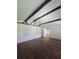 Living room with ceiling beams and view to adjacent rooms at 2821 Ne Meadowlark Trail, Duluth, GA 30096