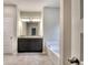 This bathroom showcases a double vanity with a bathtub, offering both style and functionality at 335 Melody Ne Ln, Cartersville, GA 30121