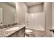 Bathroom with granite countertop vanity and shower-tub combination at 335 Melody Ne Ln, Cartersville, GA 30121