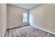 Carpeted bedroom with a window bringing in natural light at 335 Melody Ne Ln, Cartersville, GA 30121