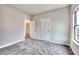 Bedroom boasts plush carpet, neutral paint, and white doors at 335 Melody Ne Ln, Cartersville, GA 30121