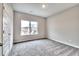Bright bedroom features neutral walls, plush carpet, and a large window at 335 Melody Ne Ln, Cartersville, GA 30121