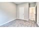 Bedroom with neutral walls and carpet near open hall at 335 Melody Ne Ln, Cartersville, GA 30121
